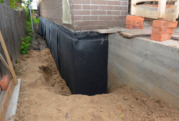 SJ Waterproofing Pros technician performing targeted Vapor Barrier Installation assessment in Griffith, IN